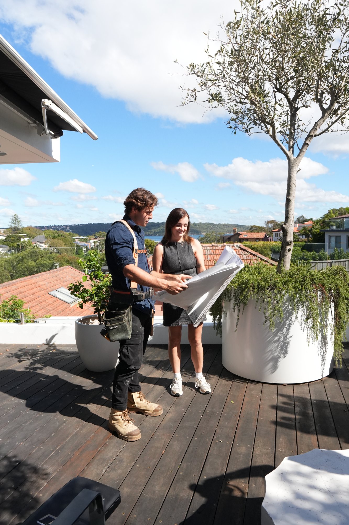 Hubert reviewing plans with client
