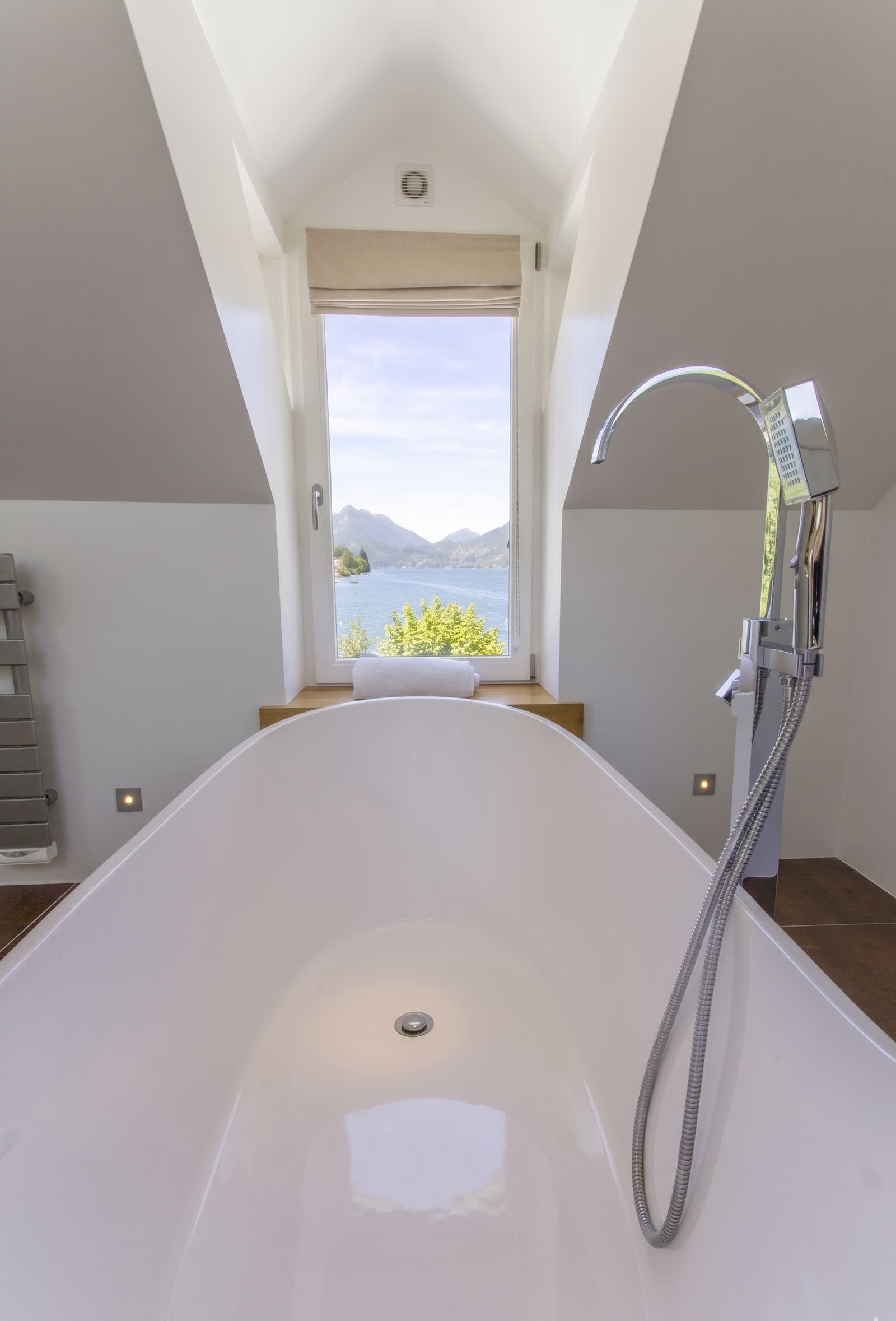 Freestanding bath with lake and mountain view, Annecy lakehouse