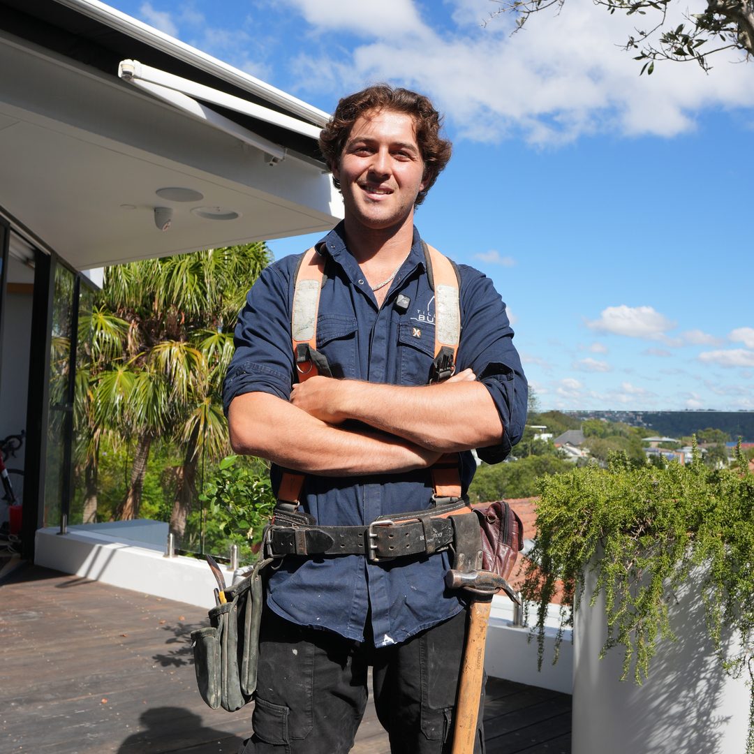 Tillow Built carpenter on a completed rooftop deck overlooking Sydney